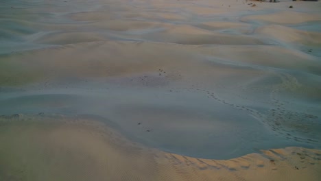 drone aerial 180 degree pan shot of sand dune desert