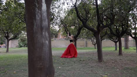 Woman-dancing-in-the-middle-of-a-forest---pull-away-shot