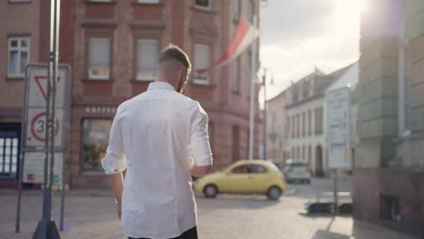 someone-walks-through-streets-at-sunset