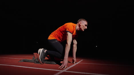 athlete in starting position for sprint race