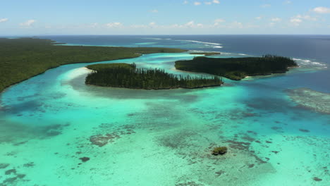 small islands in picturesque oro bay in new caledonia on the isle of pines - aerial flyover