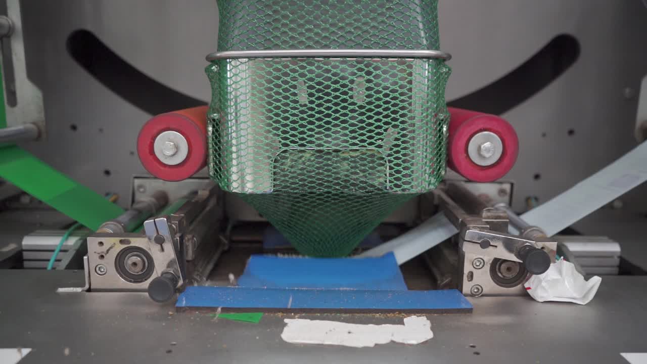 SLOW MOTION SHOT OF AVOCADO PACKING HOUSE MACHINERY