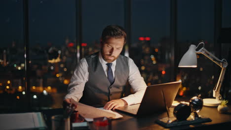 company man overwork late evening at workplace. busy worker professional study