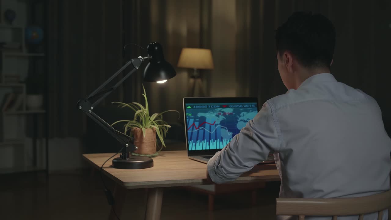 Businessman working late night on laptop