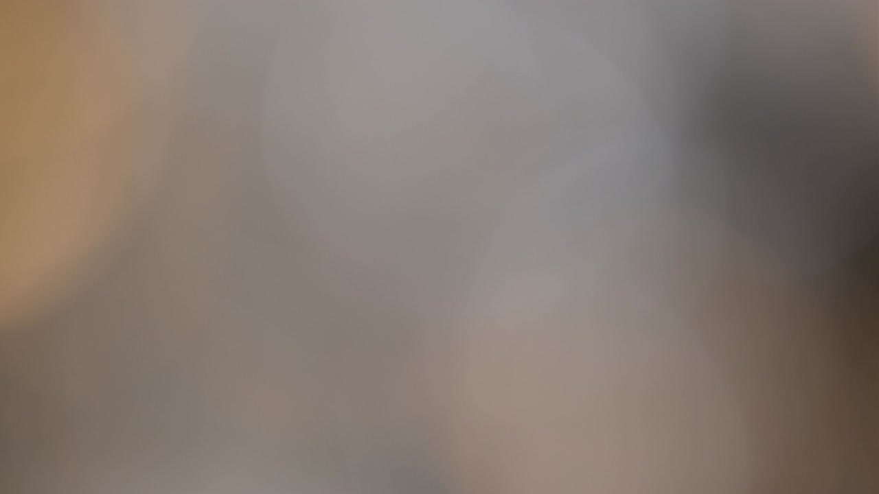 Abstract light leaks on black background.