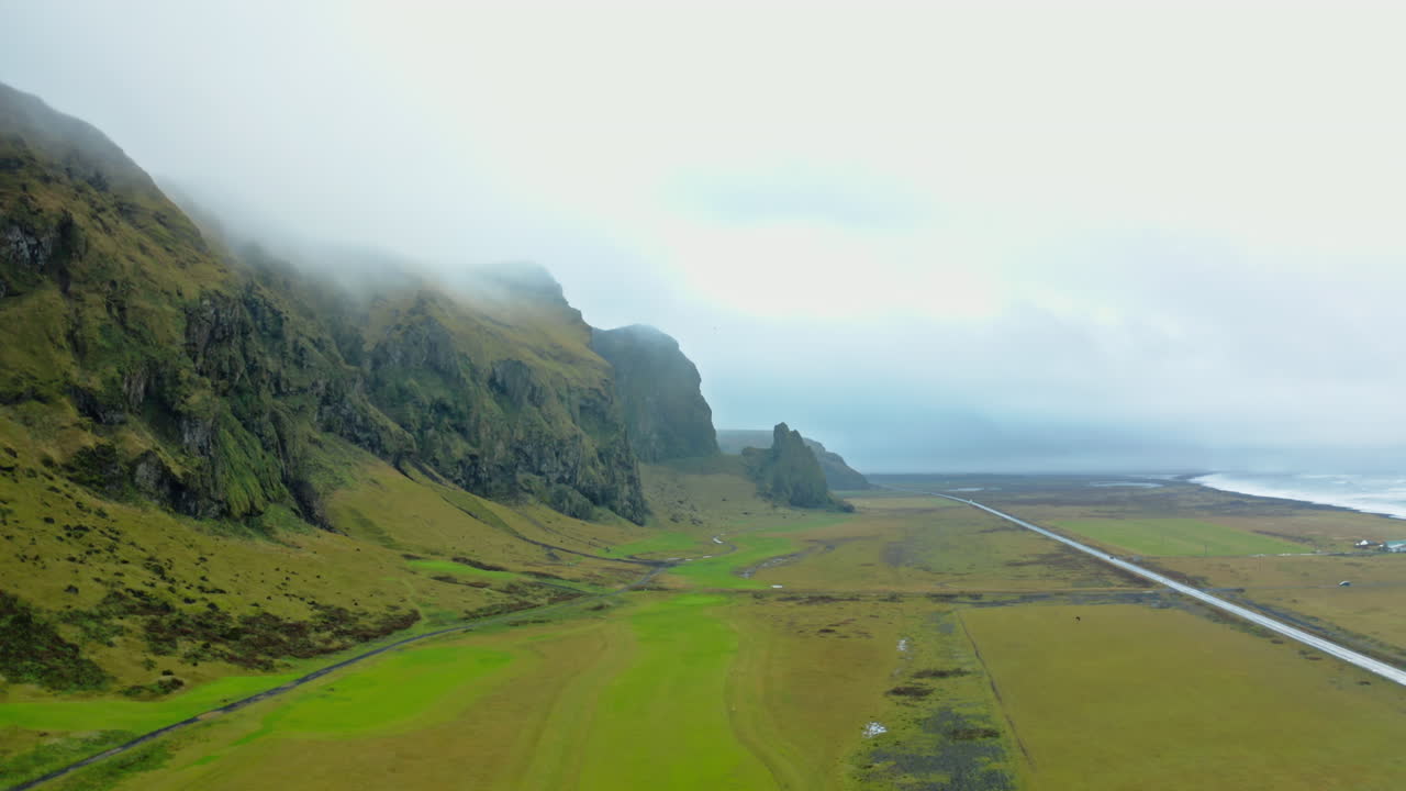 Icelandic Coastline Landscape with Misty Mountains