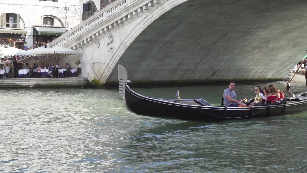 Family sailling in gondola, venice, slow motion