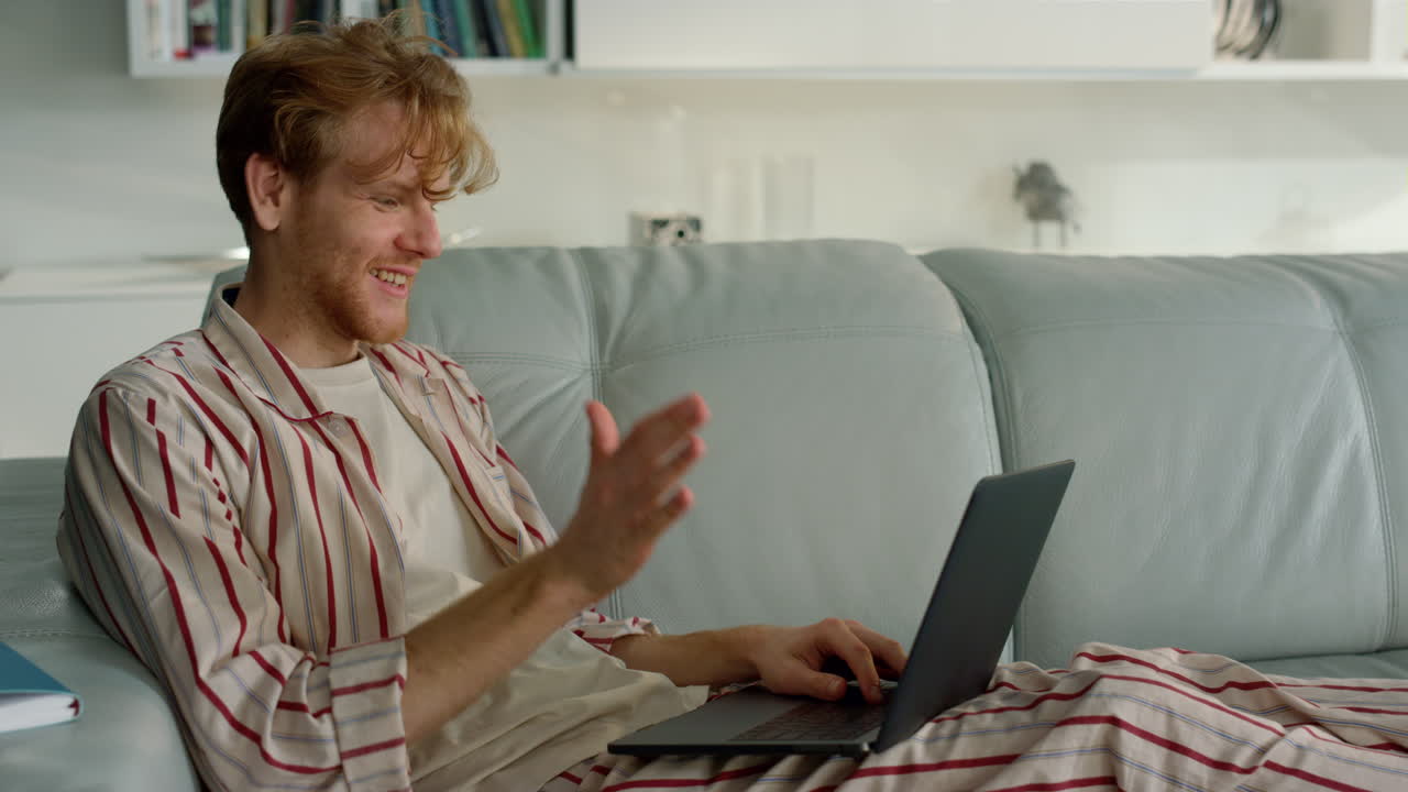 Online teacher talking laptop on quarantine closeup. Happy man waving hello