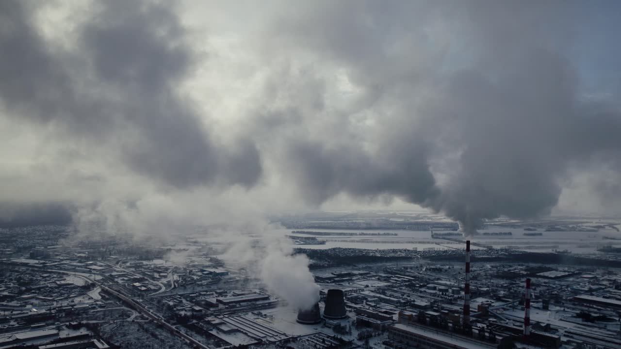 Aerial View of Industrial Area in Winter with Smoke Emissions