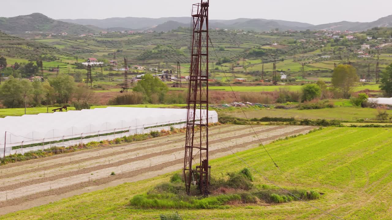 Scenic view of Albania's Berat Kucova oil field with green landscapes