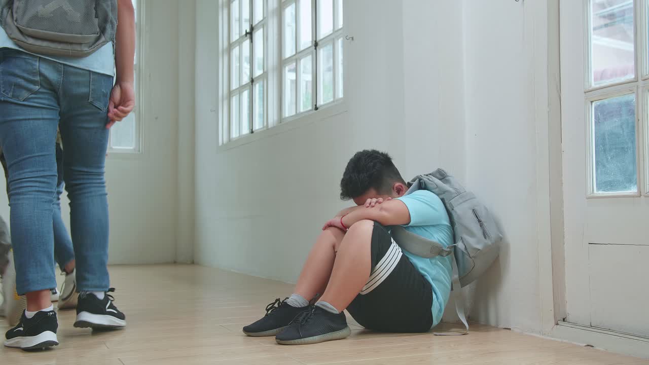 Young Asian Students Bullying Little Boy