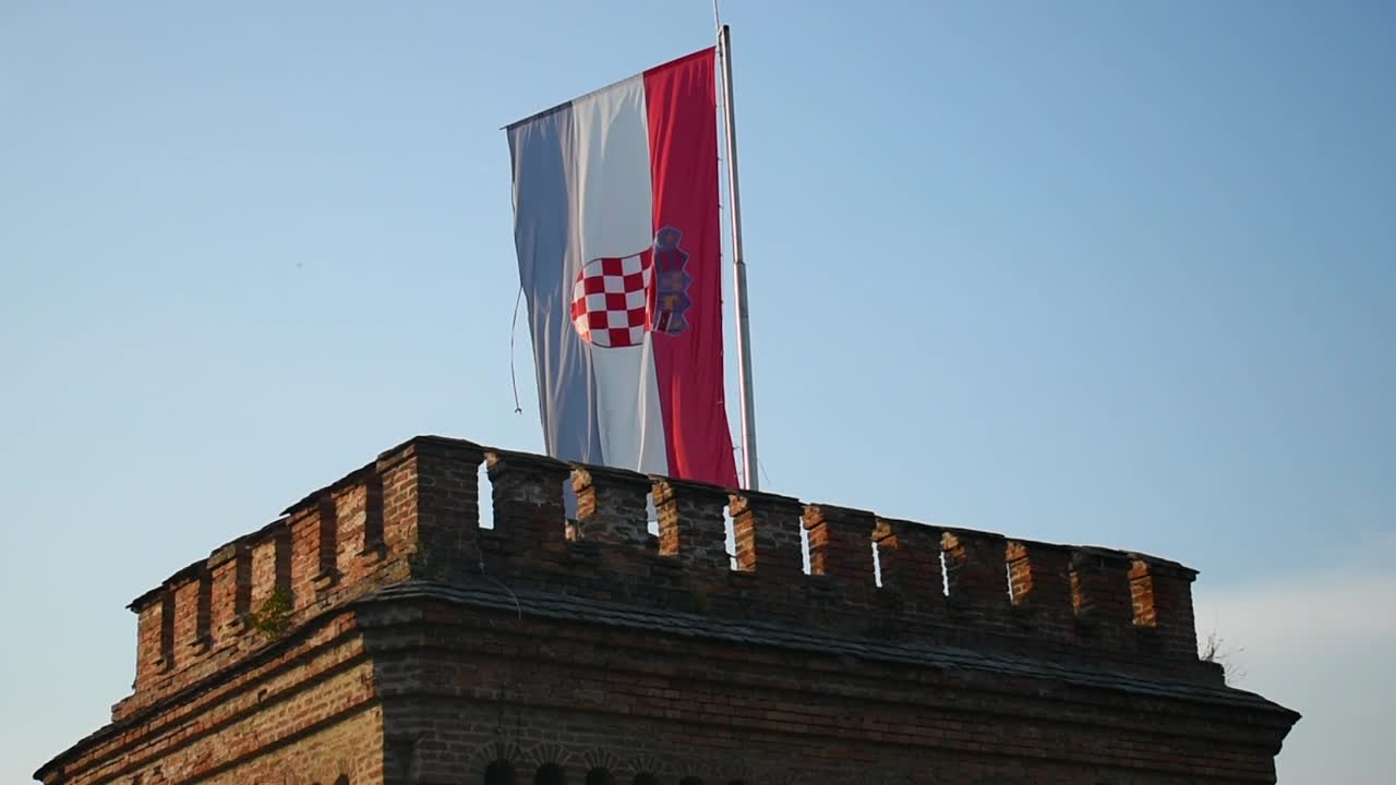 Croatian flag in the wind, on an old tower