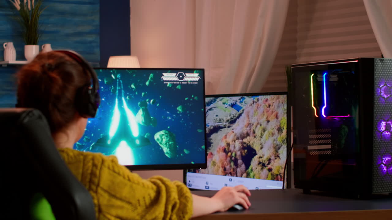 Gamer trying to win space shooter video game playing from home