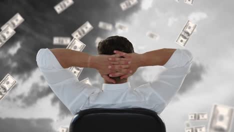 businessman sitting outside while dollars fall down.