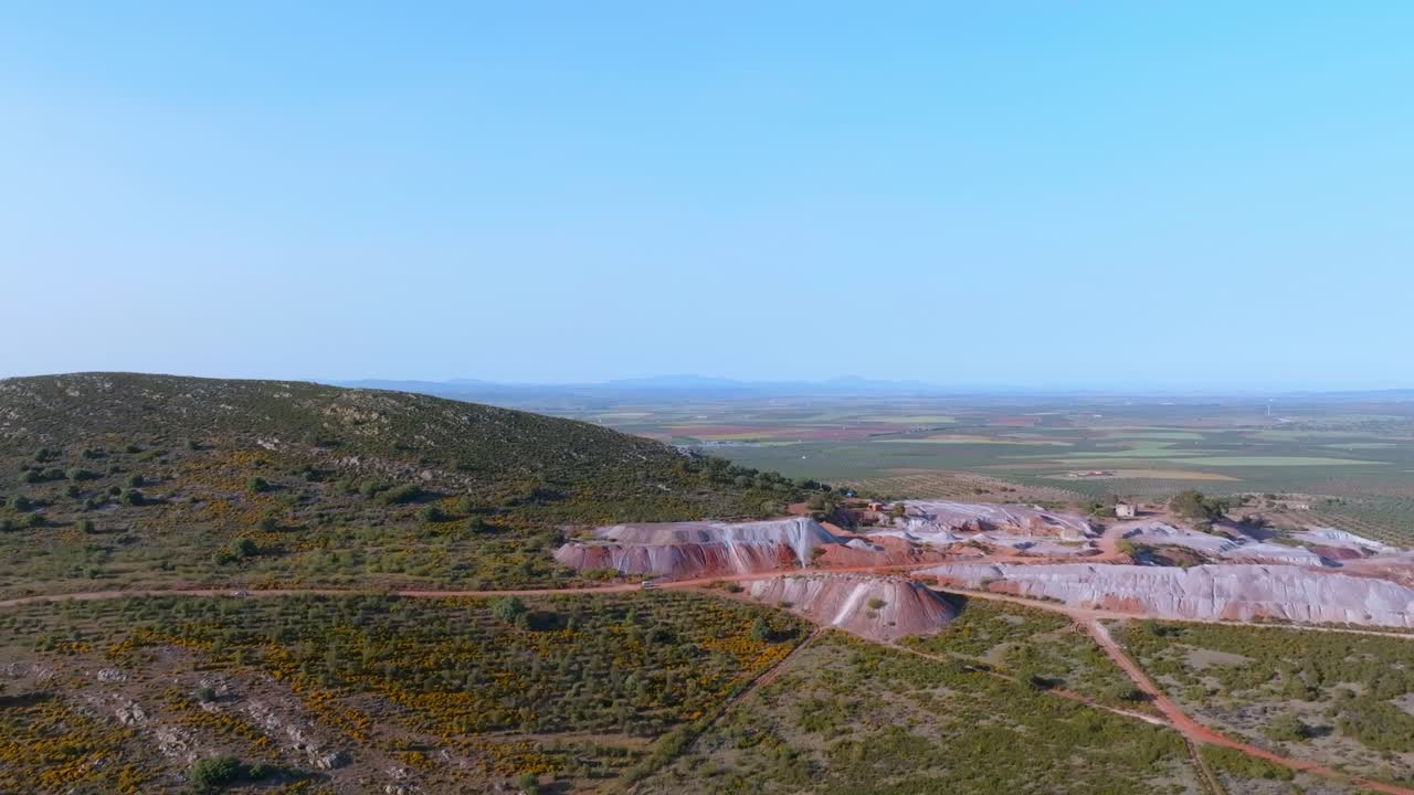 The Dehesa Extremeña landscape is scarred by the barren wasteland left by an old mine