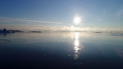 ice melting from sunny winter landscape