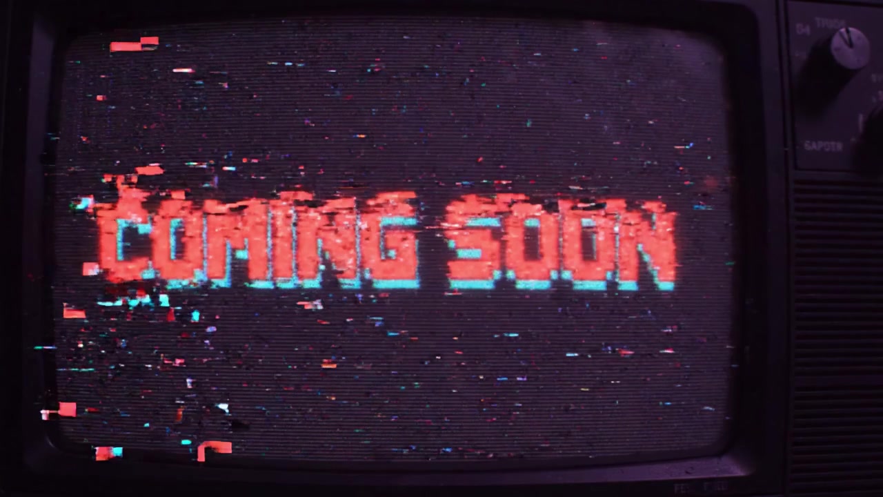 A Retro Television Display Glitches from 'Coming Soon' to Distorted Text, Capturing the Nostalgic Aesthetic and Anticipation of Upcoming Content in a Digital Era.