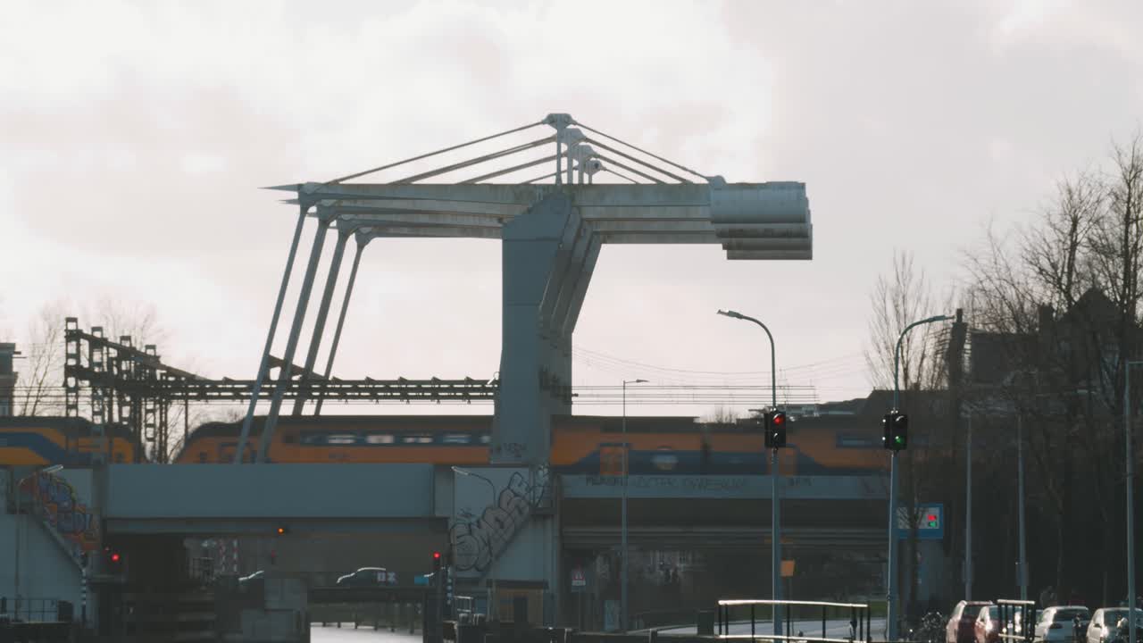 Dutch NS train passes special bridge in Amsterdam, Netherlands