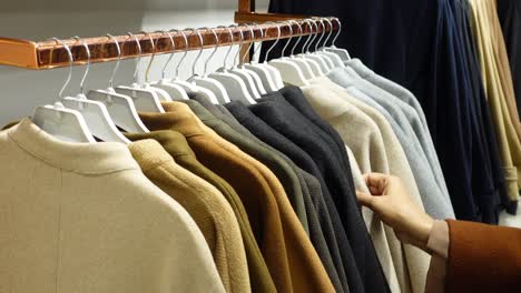 various coats on hangers in a store