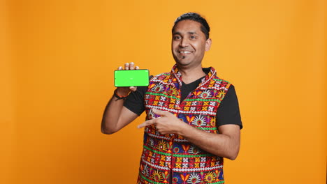 person reviewing copy space mockup smartphone, studio background