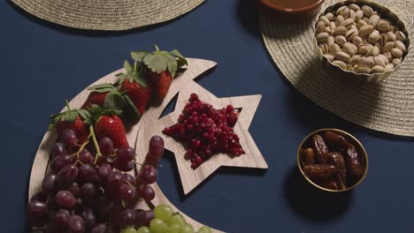 close up of food on muslim family table at home set for meal celebrating eid