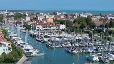 beautiful yachts and motorboats of darsena dell'orologio in caorle, the metropolitan city of venice, italy