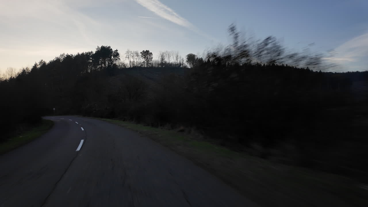 Sunset over a winding mountain road