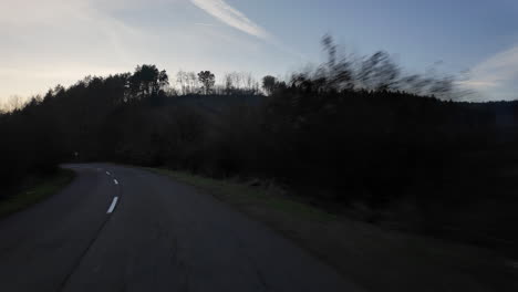 sunset over a winding mountain road