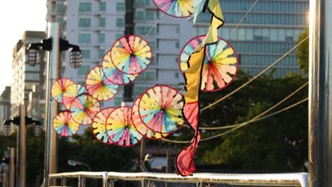 vibrant windmill spins against a city backdrop