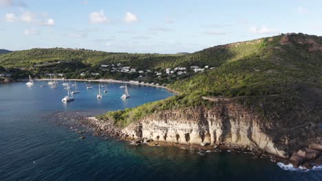 aerial view over pillars of hercules and galleon beach in antigua and barbuda - drone shot