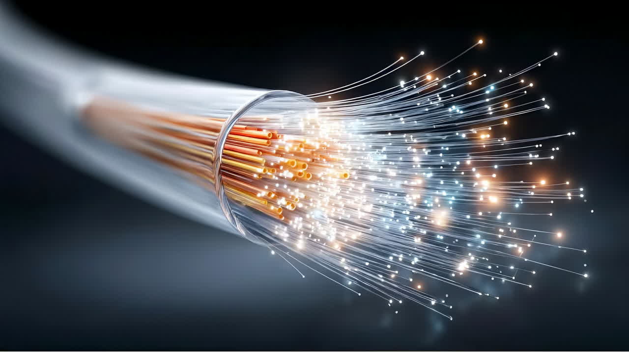 Fiber optics send light signals. Fiber optic cables show light signals traveling through glass fibers in a dark setting
