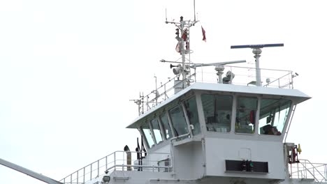 command bridge of a boat with moving antennas and flags