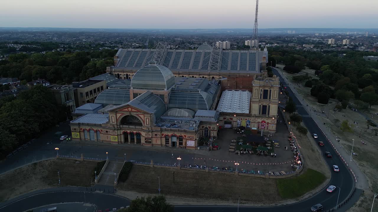 Alexandra Palace aerial view rising up ornate Victorian building exterior with London cityscape view