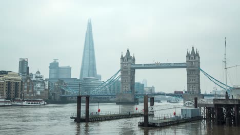 sliding time-lapse revealing the shard and tower bridge on a misty day