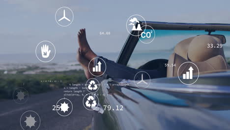 environmental data and sustainability animation over person relaxing in car by beach