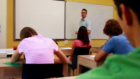 Lecturer-talking-to-his-class-and-answering-a-question