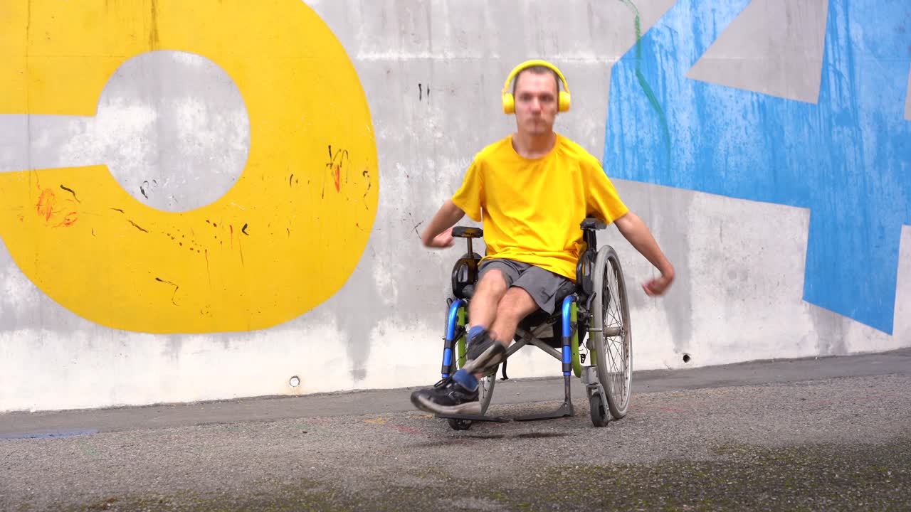 Man in Wheelchair Enjoying Music and Dancing Outdoors
