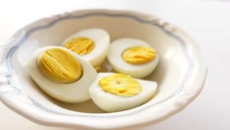 closeup of boiled eggs in a white bowl