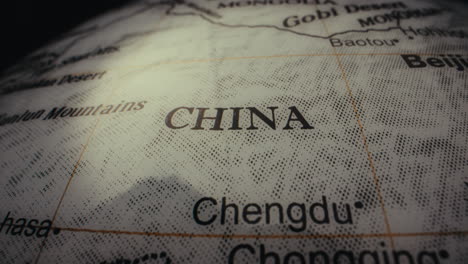 close-up of a world globe map, highlighting china