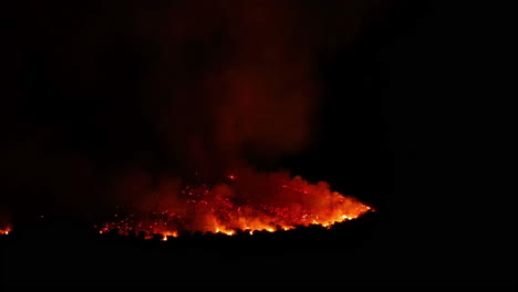 shot of bright hot lava burning in malaga, spain at night time