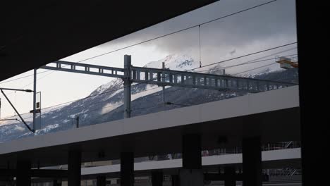 railway station in basel, mountains behind the train station in basel, switzerland