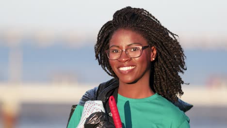 Happy-young-volunteer-smiling-at-camera