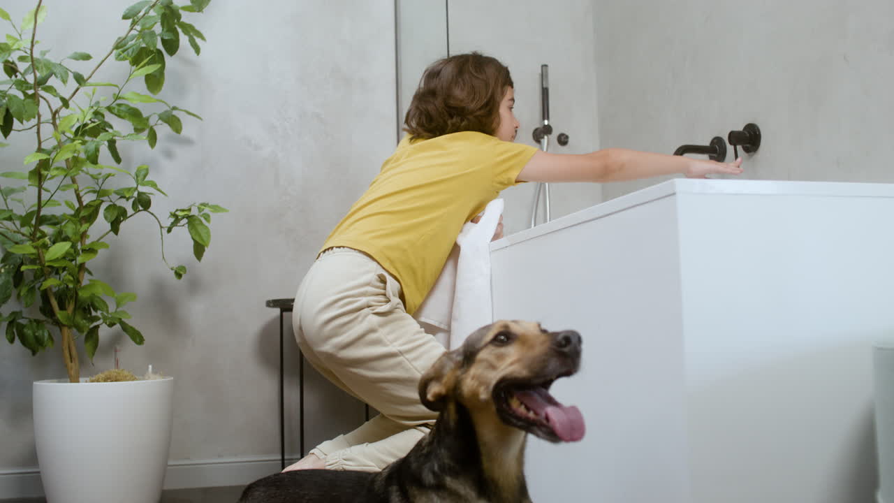 Free stock video - Girl and dog at the bathroom