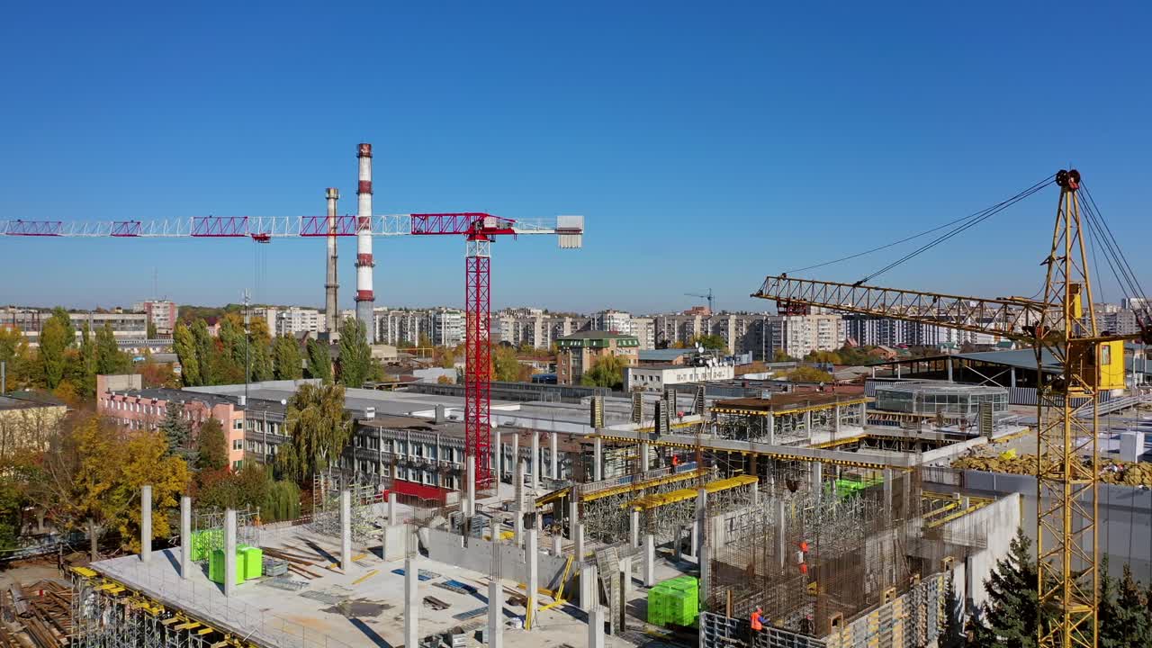 Busy Industrial Construction Site. Aerial shooting of building construction site