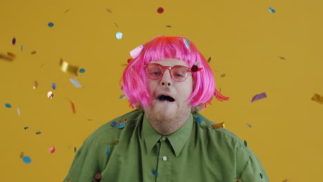 man with pink wig and confetti
