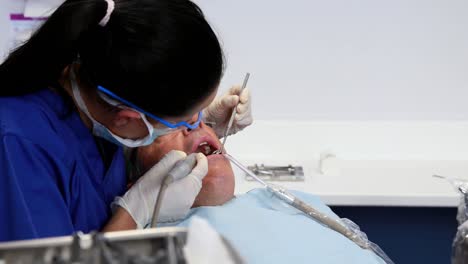 dentist examining a patients teeth