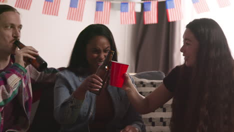 Friends-At-Home-Celebrating-With-Party-For-American-Independence-Day-4th-July-Doing-Cheers-With-Alcohol-5