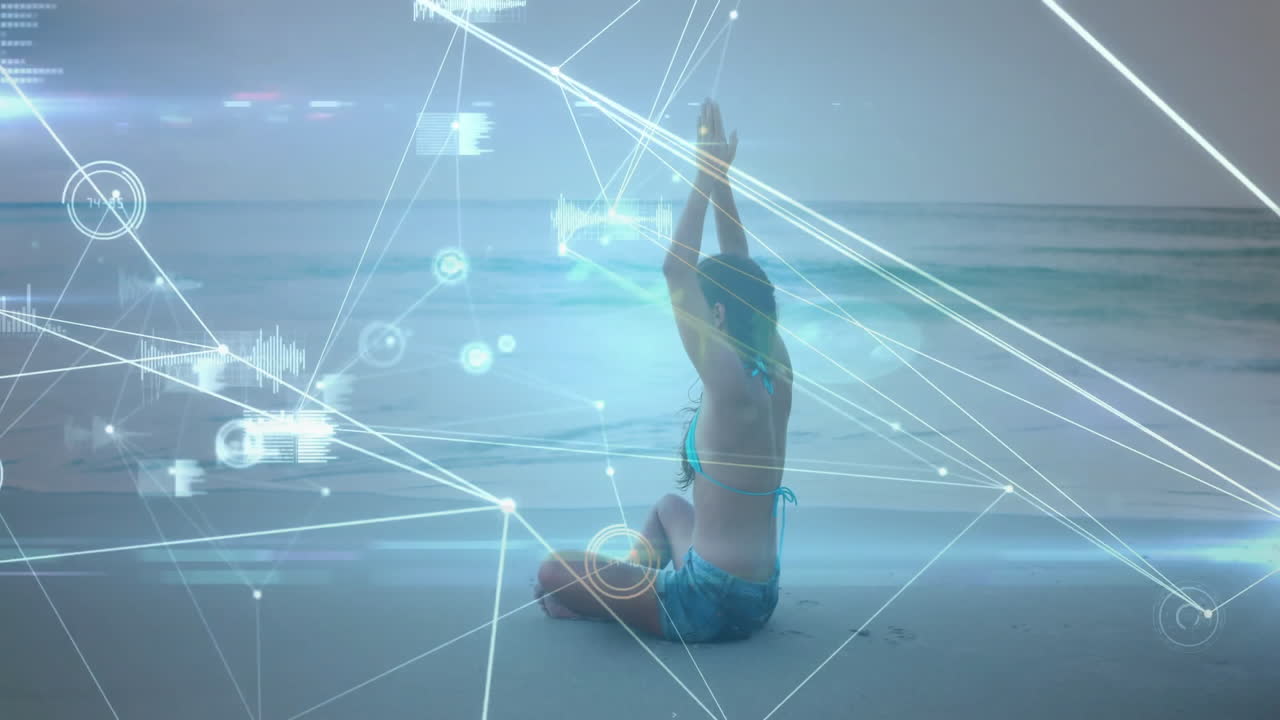 Performing yoga on beach, digital network animation overlaying serene scene