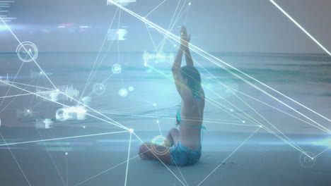 performing yoga on beach, digital network animation overlaying serene scene