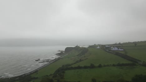 aerial view of ireland's countryside surrounded by low lying fog